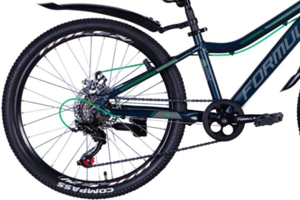 Cykel med svarta hjul och grönt mönster på ramen.